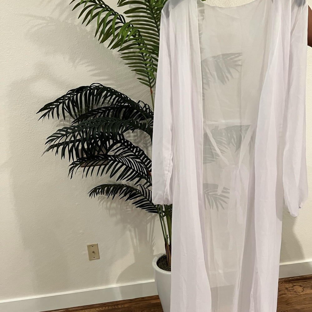 White swimsuit cover up. Never worn.